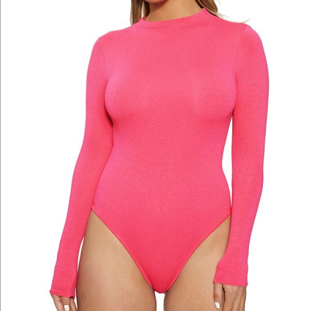 never worn. brand new. tags on. Naked Wardrobe mock neck thong bodysuit Hot pink
